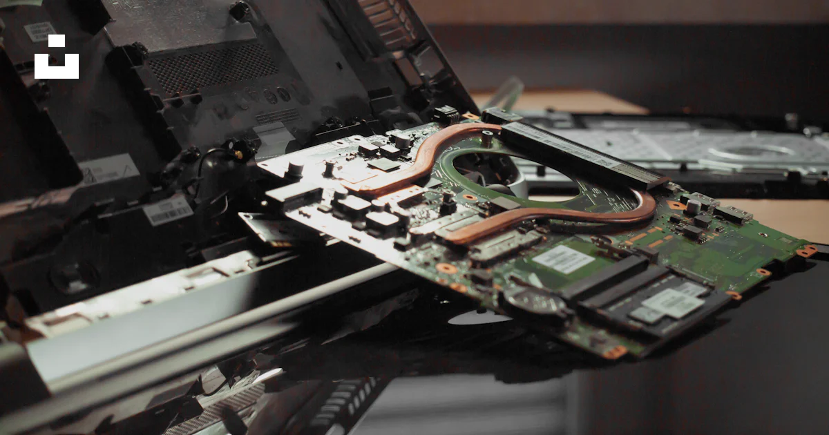 Slightly Open Computer An open laptop computer sitting on top of a table photo – Free Hardware ...