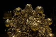 Elegant metal wall art shaped like blooming flowers with a subtle metallic sheen.