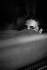 A duo portrait showing two people connected by a subtle glance.