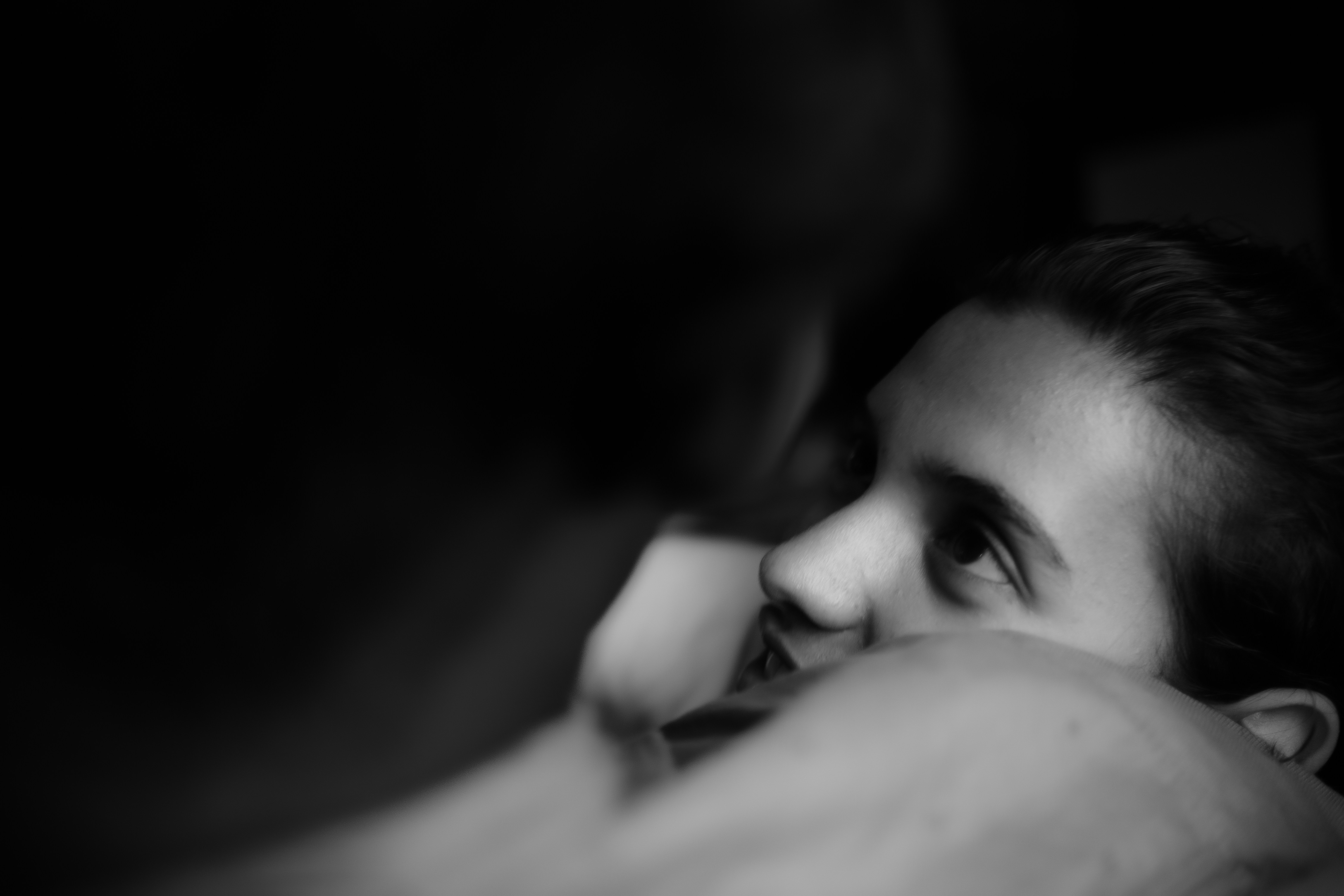 a black and white photo of a woman smiling