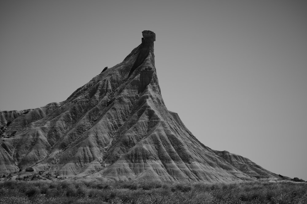 a black and white photo of a mountain