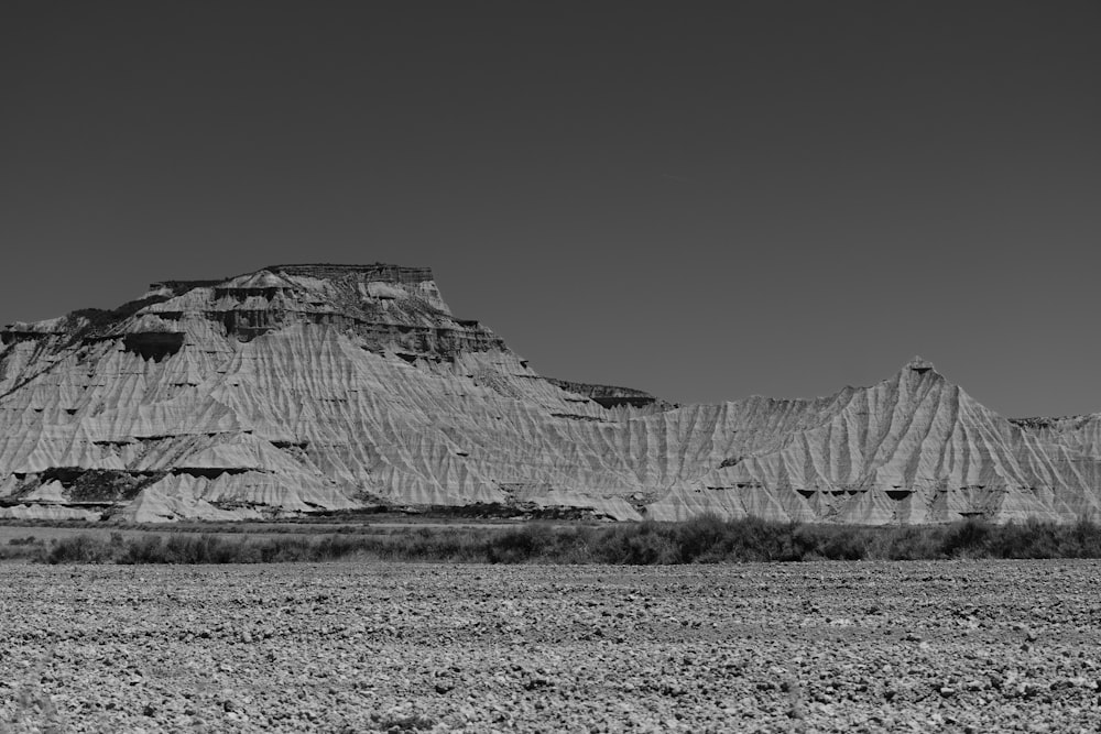 a black and white photo of a mountain range