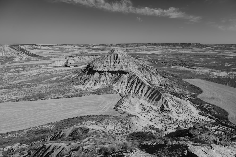 a black and white photo of a desert landscape