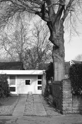 Black and white photo of the original Iscon Club building from the 1950s.