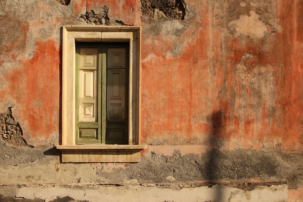 an old building with a door and window