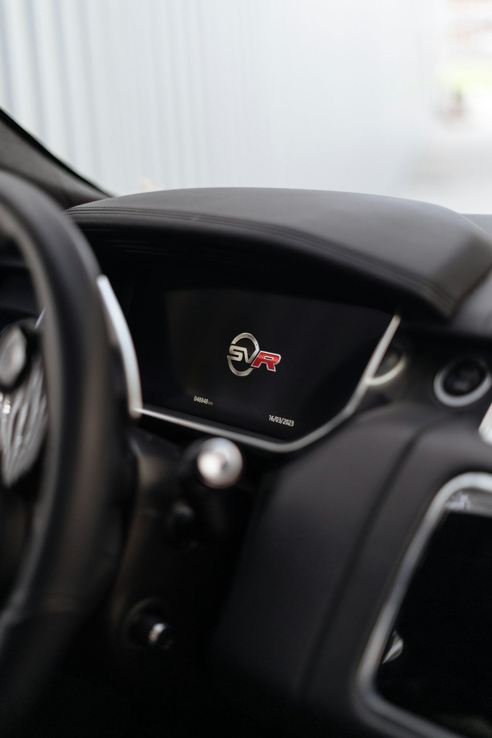 a close up of a steering wheel and dashboard of a car