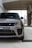 A close-up of a sleek Range Rover parked in an urban setting.