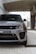 A close-up of a sleek Range Rover parked in an urban setting.