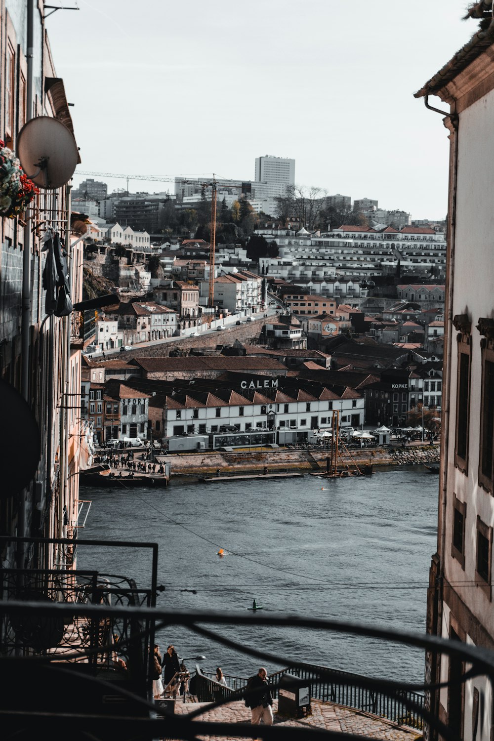 a river running through a city next to tall buildings