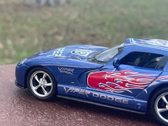 Close-up of a blue-themed toy car display with matching blue die cast cars.