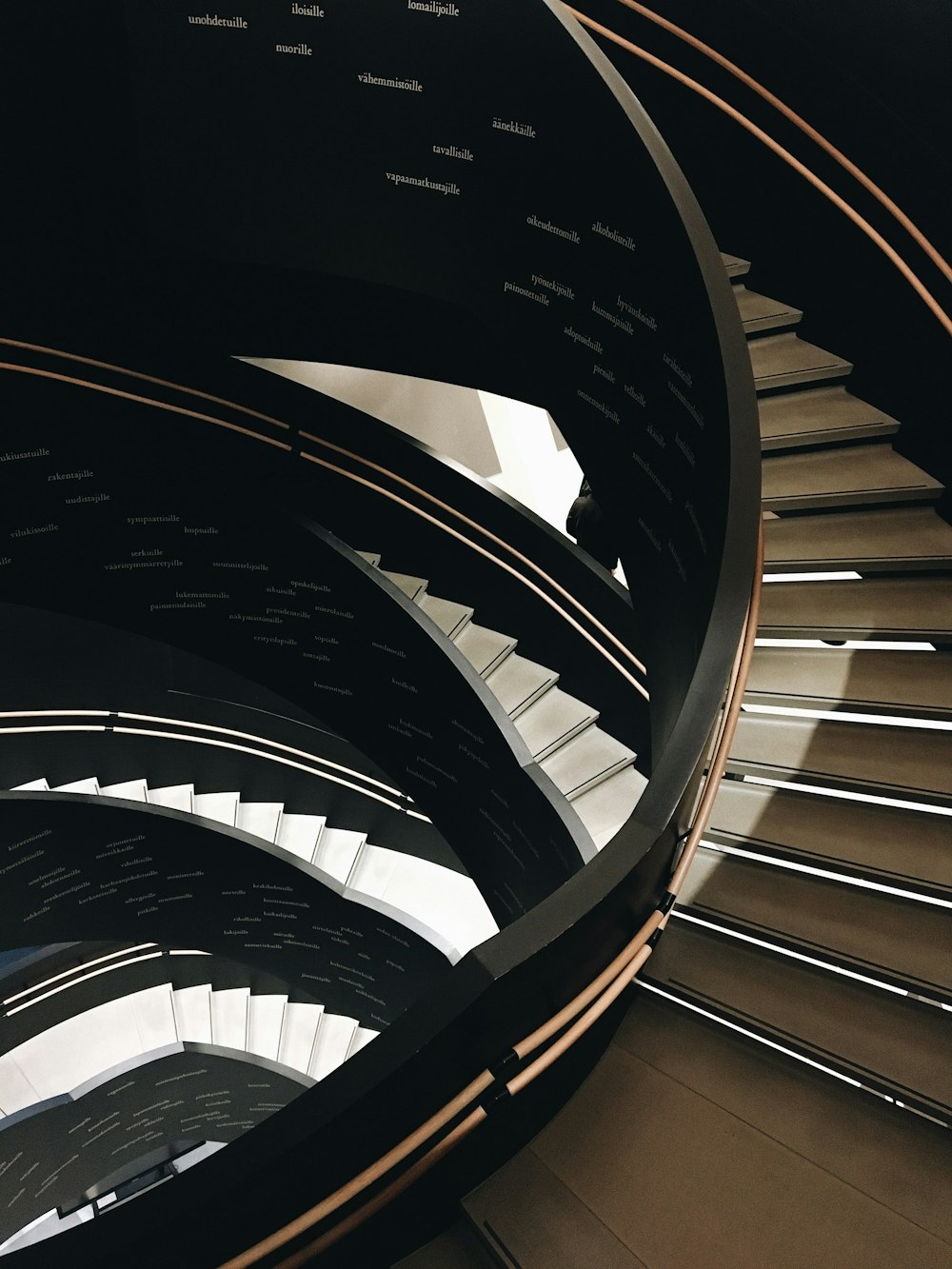 a spiral staircase made of wood and metal