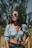 a woman wearing sunglasses and a crop top