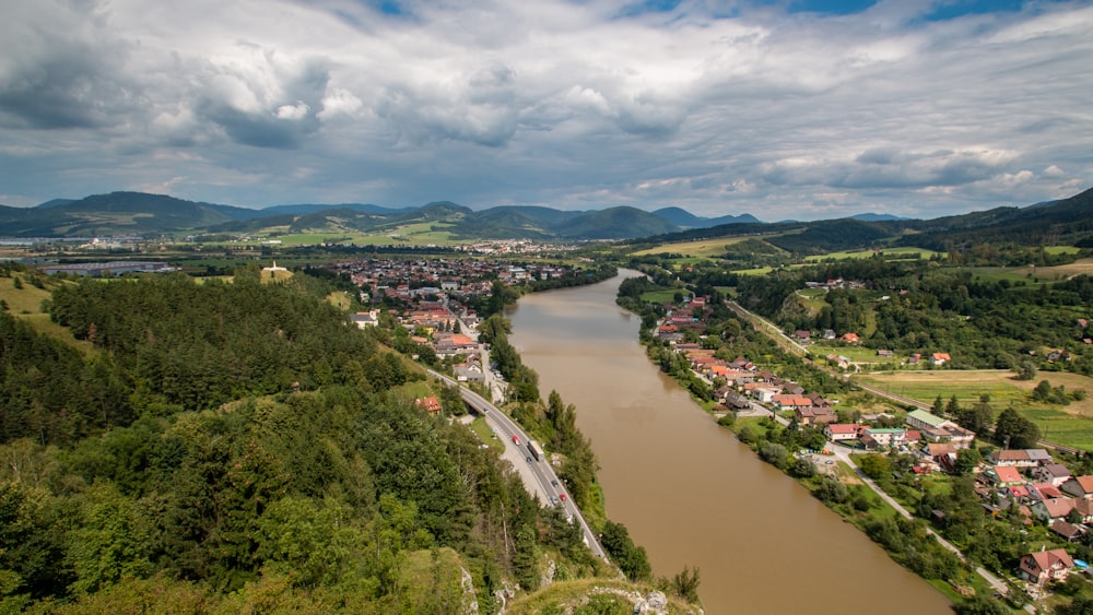 a river running through a lush green countryside