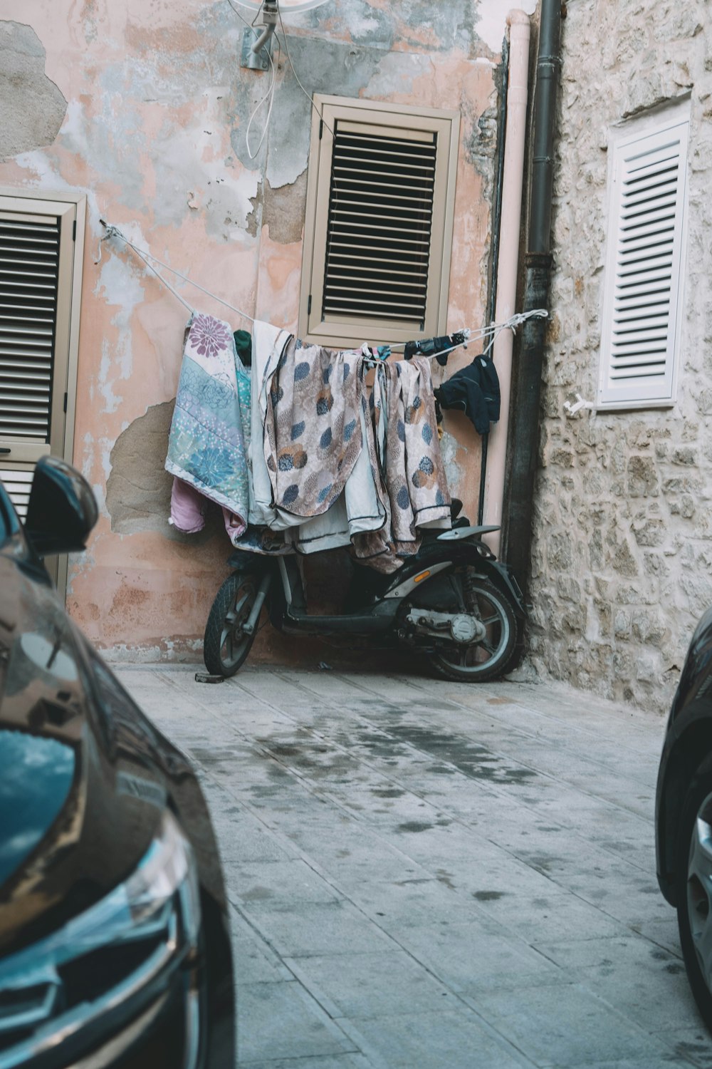 a motor scooter parked next to a building