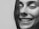 A close-up of a smiling woman sharing her experience.