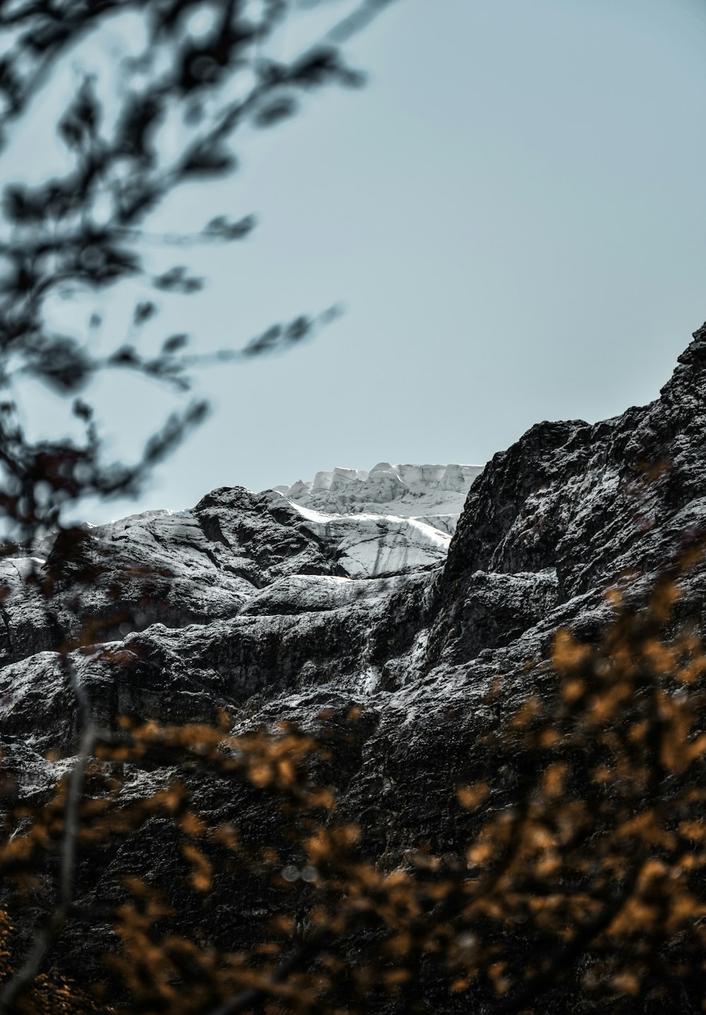 a mountain with a snow covered peak in the distance