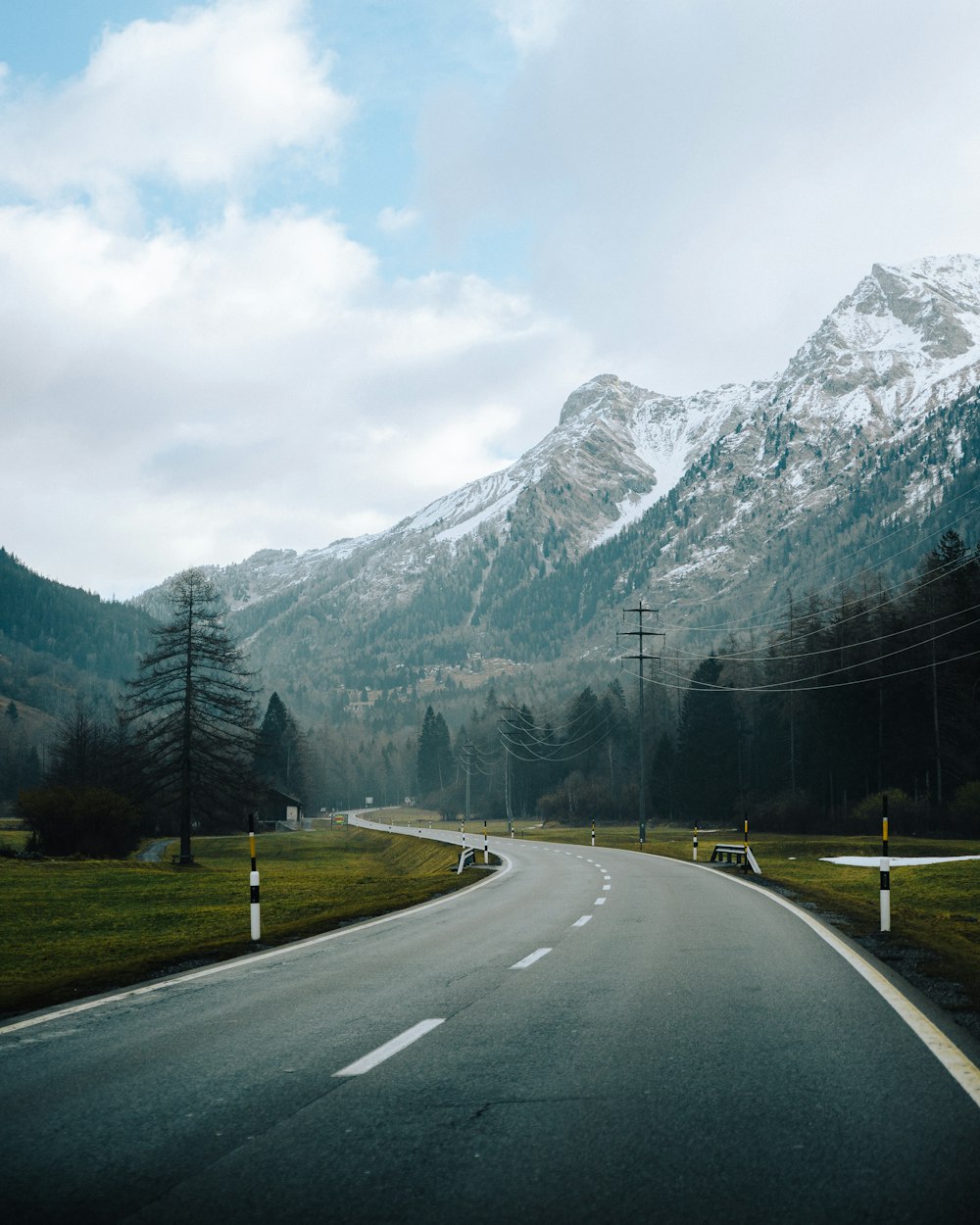 a road with a mountain in the background