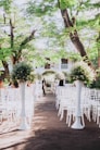 a group of white chairs sitting next to each other
