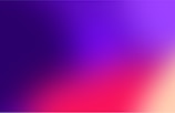 A vibrant gradient background representing innovation and technology.