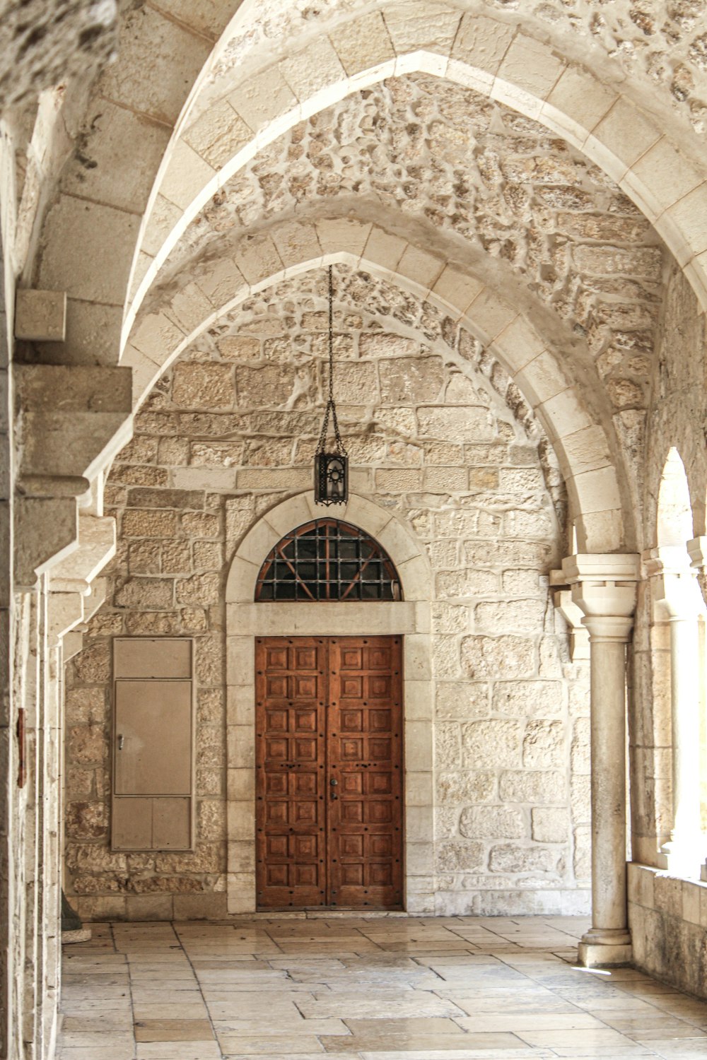 a large stone building with a wooden door