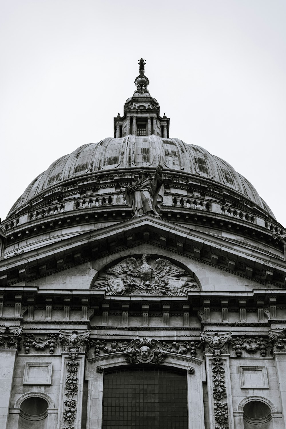 a black and white photo of a building with a dome