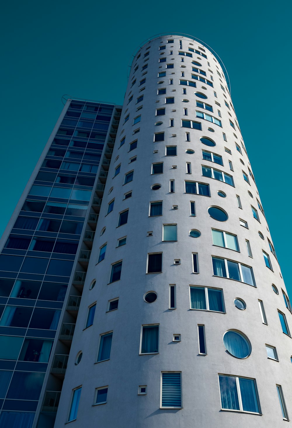 a tall white building with lots of windows