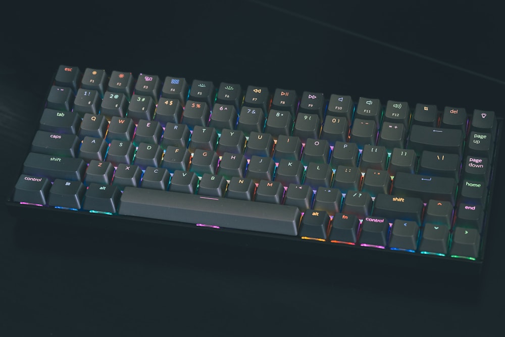 a close up of a keyboard on a black surface