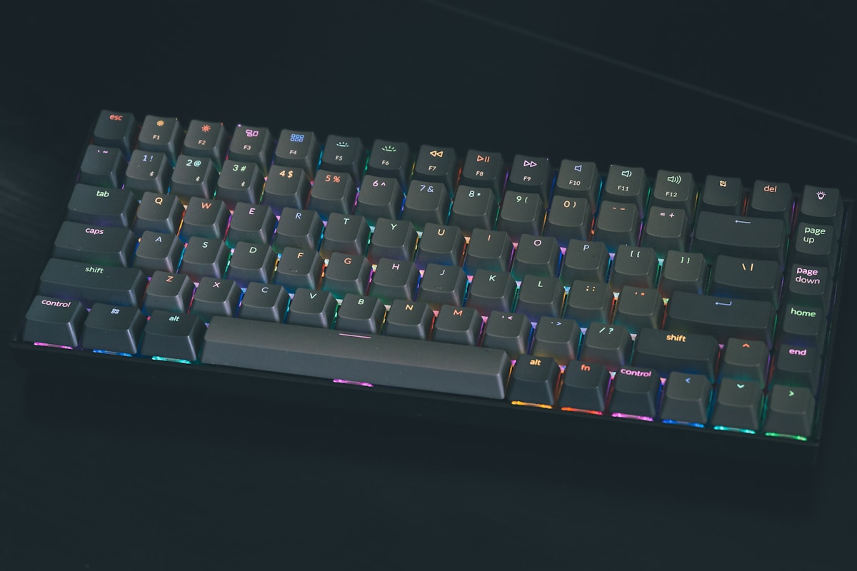 A close up of a keyboard on a black surface