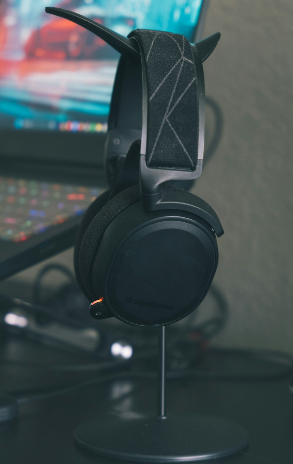 a close up of a pair of headphones on a desk