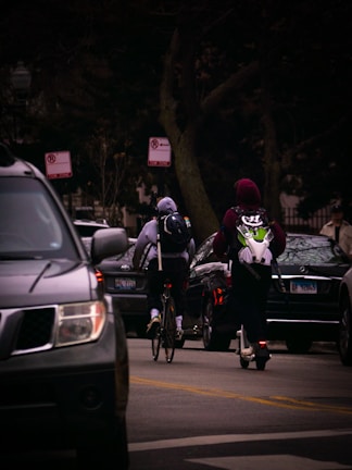 A cityscape with a courier bike navigating through traffic.
