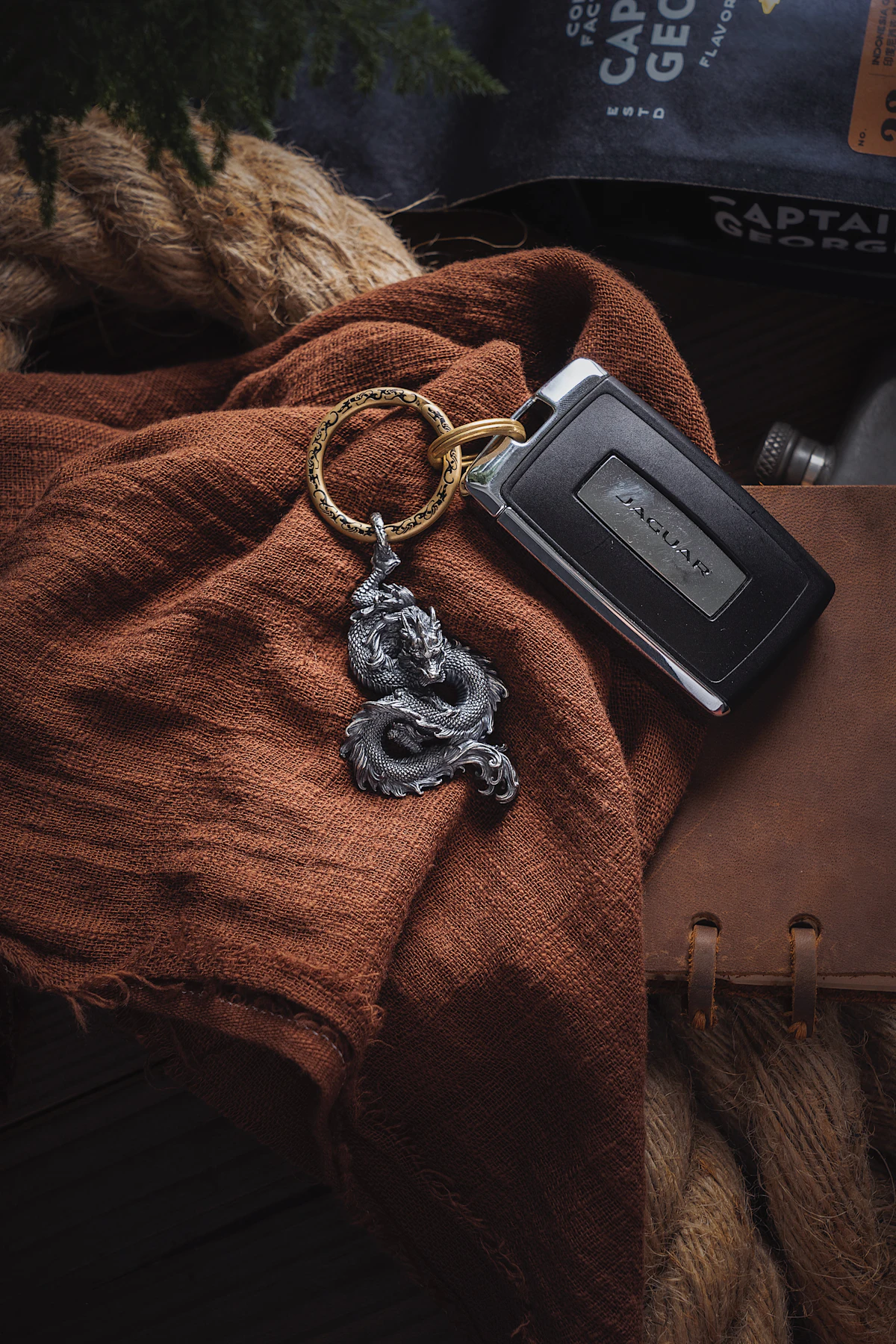 Travel insurance documents and car rental keys on desk