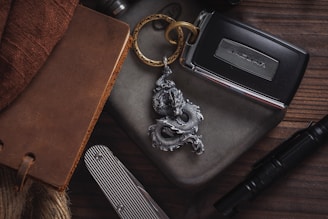 Collection of various metal items like keychains, cups, and knives with laser engravings