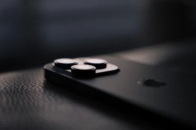 A close-up of a sleek smartphone on a desk.