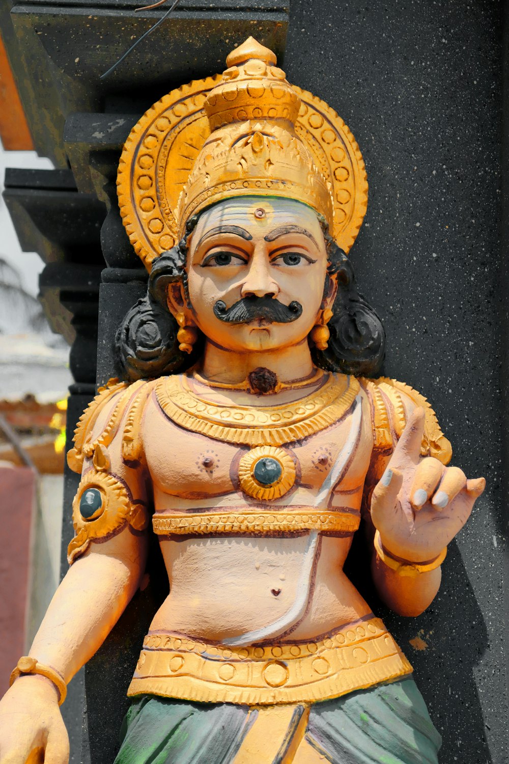 a statue of a man with a mustache and moustache