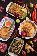 a table topped with plates filled with food