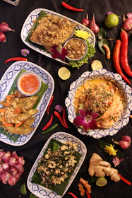 a table topped with plates filled with food