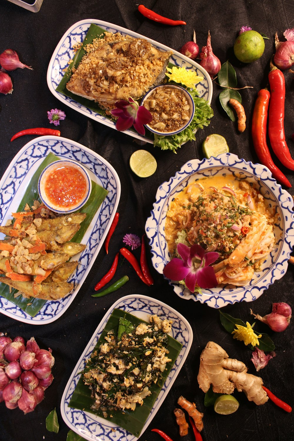 a table topped with plates filled with food