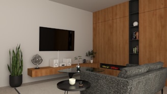 a modern living room with a large screen tv