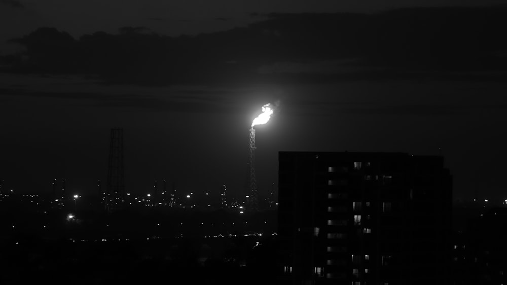 a black and white photo of a city at night