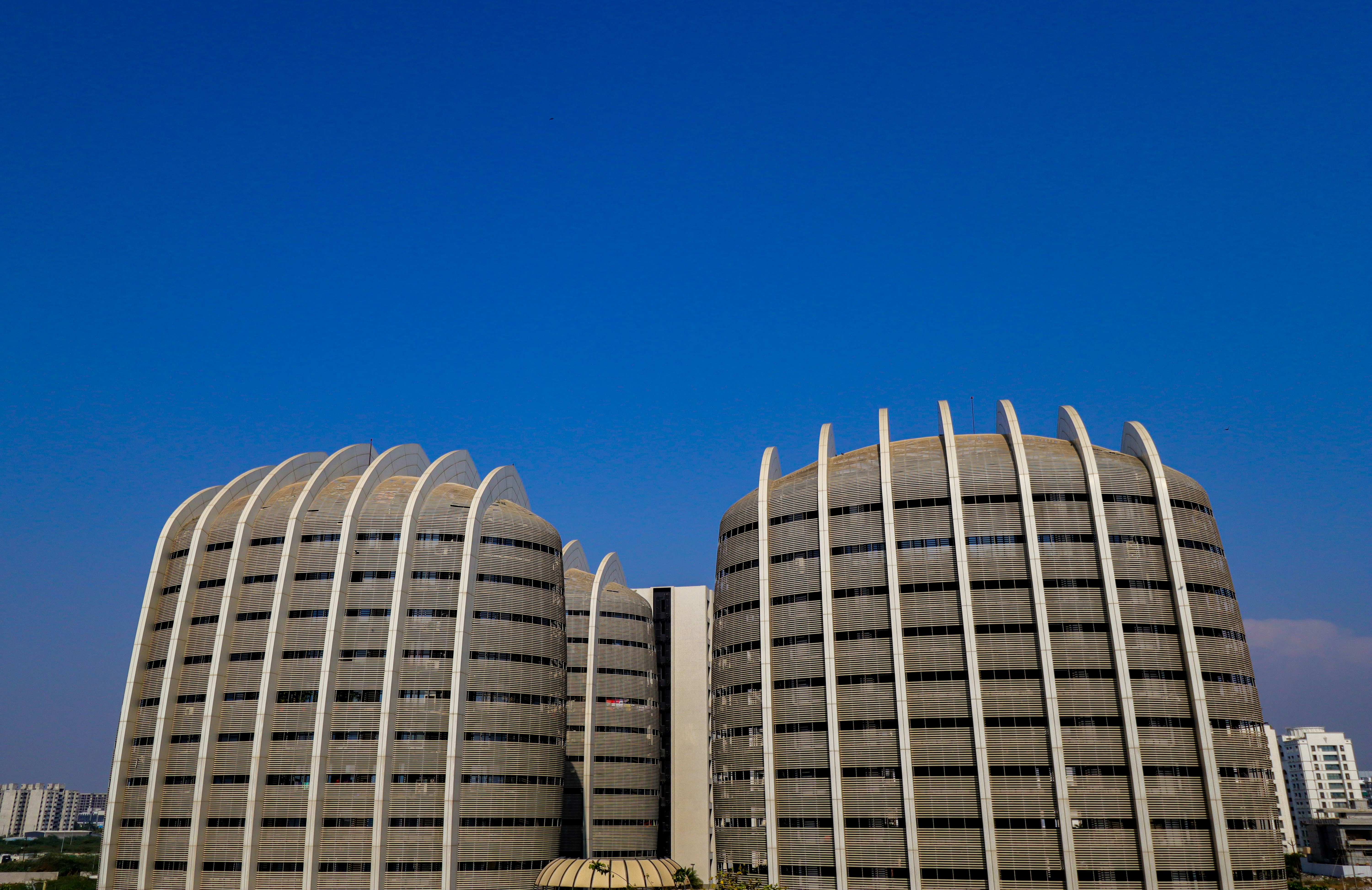 a couple of large buildings sitting next to each other