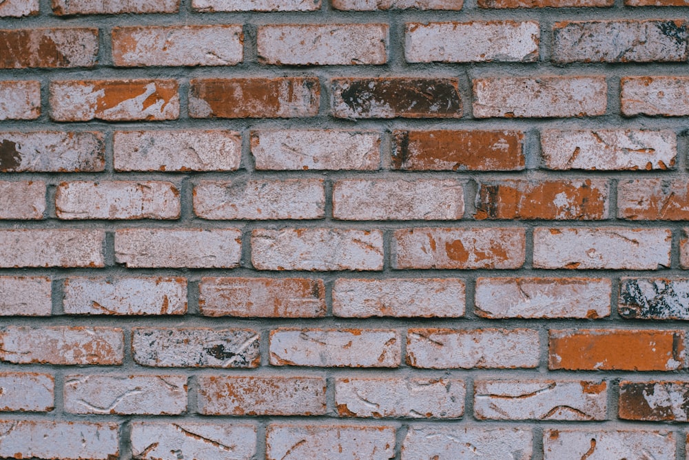 a close up of a red brick wall