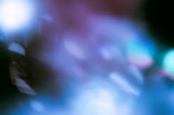 An abstract composition with soft focus and blurred light effects, featuring a blend of cool tones and subtle highlights. The image contains various shapes and gradients, giving it a dreamy and surreal atmosphere.