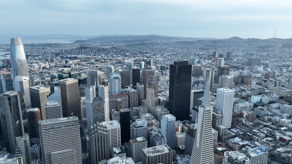 an aerial view of a city with tall buildings