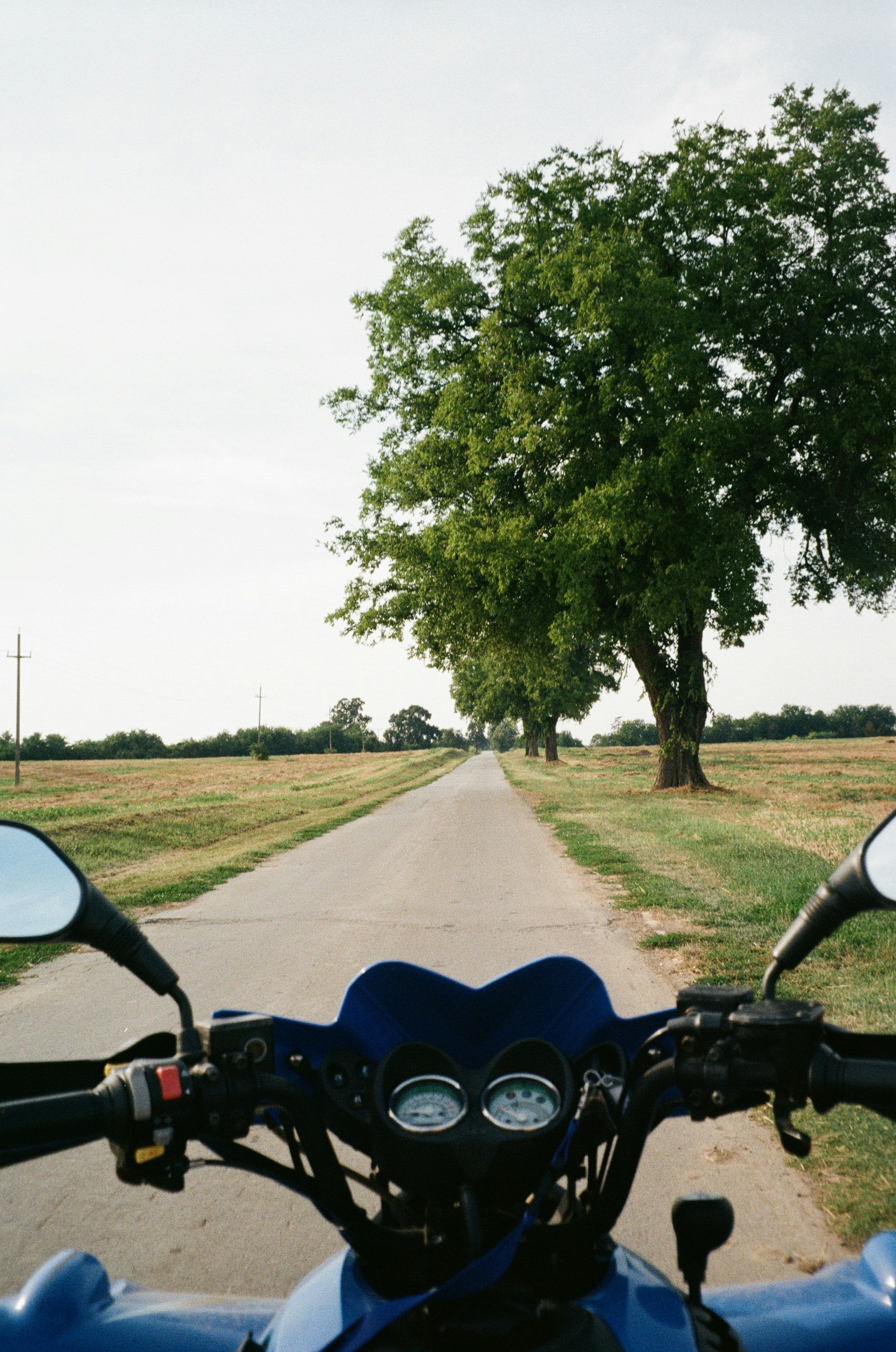 a motorcycle parked on the side of a road
