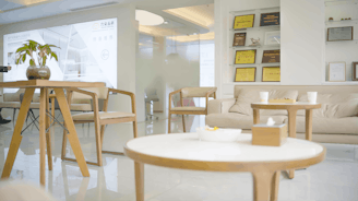a living room filled with furniture and a table