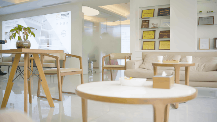 a living room filled with furniture and a table