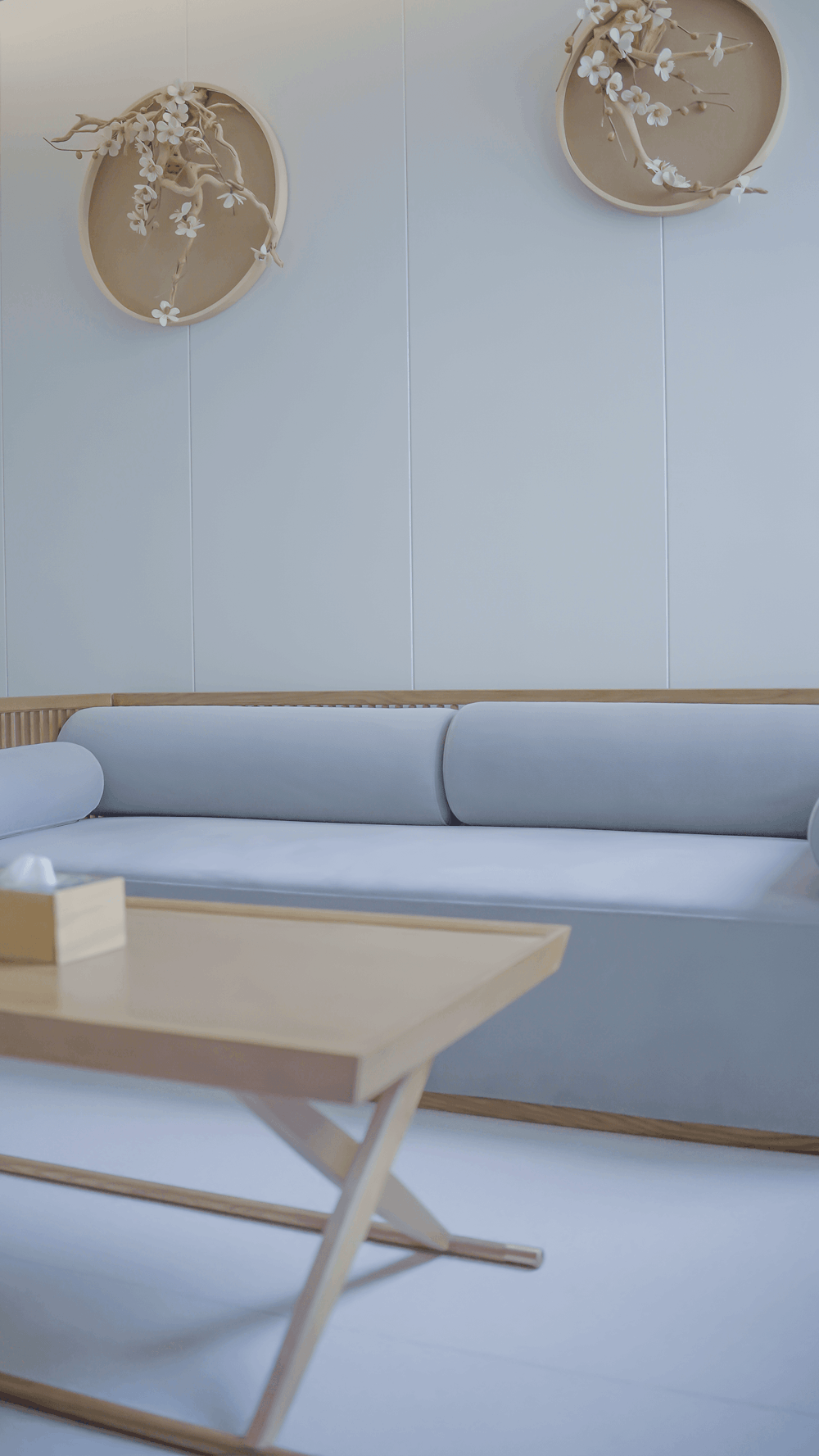 a living room with a blue couch and a coffee table