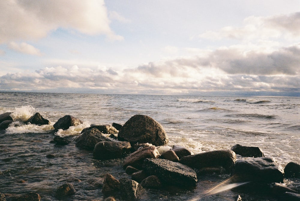 a large body of water surrounded by rocks