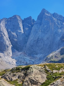 A stunning mountain landscape with a clear blue sky.