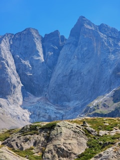 A stunning mountain landscape with a clear blue sky.